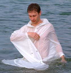 swimming in white nylon poncho