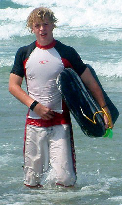 surfing bodyboarding swim shirt with white shorts