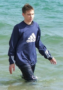 Open water swimming in tracksuit